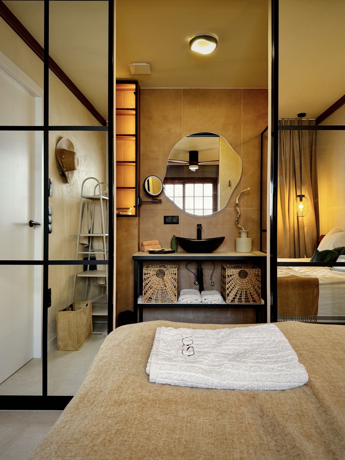 The YOSO bathroom with a walk-in shower in natural tones