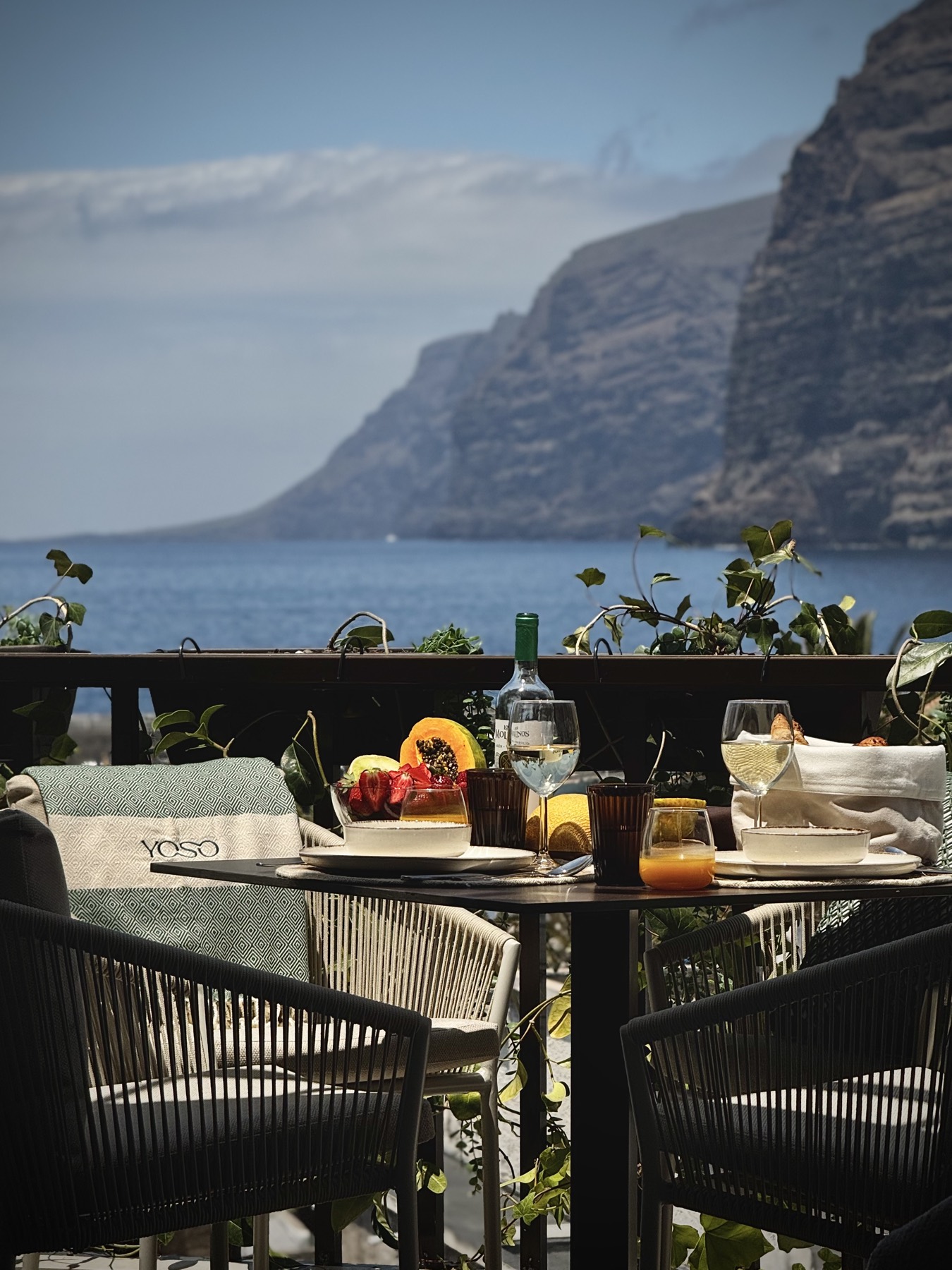Breakfast on the YOSO balcony with the cliffs and ocean beyond